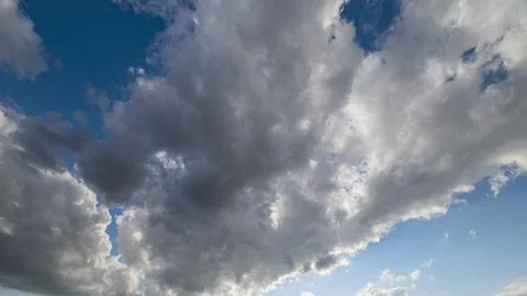 Dramatic and Breathtaking Cloudscapes Beneath a Beautifully Bright Blue Sky Abov Stock Photos