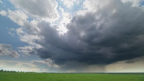 A Dramatic and Captivating Cloudscape Displaying Beautiful Views Over Lush Green Stock Photos