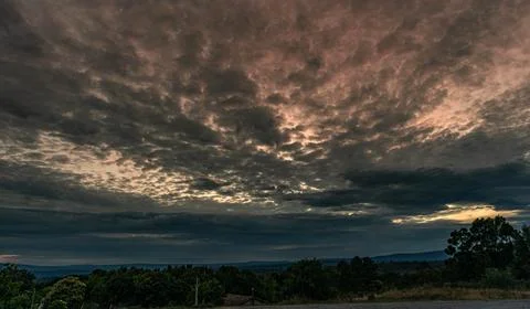 Dramatic and Cloudy Sky Over the Countryside Stock Photos