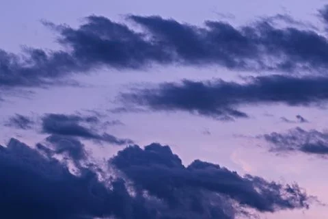 A dramatic and colorful cloudy sunset sky. Stock Photos