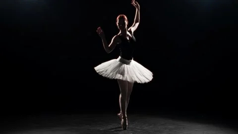 Dramatic and elegant dance of beautiful ballerina in darkness, slow motion shot Vídeo Stock 292870727