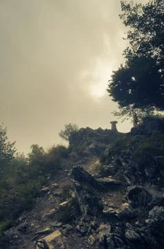 Dramatic and gloomy path to mountain top Stock Photos