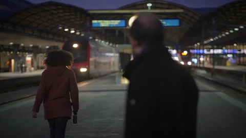 Dramatic and Intense Encounter Between Two Figures in a Vibrant Urban Stock Footage 285433173