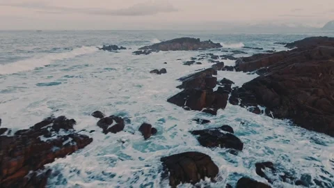 Dramatic and Majestic Ocean Waves Crashing with Force on the Rugged Rocky Stock Footage 303703869