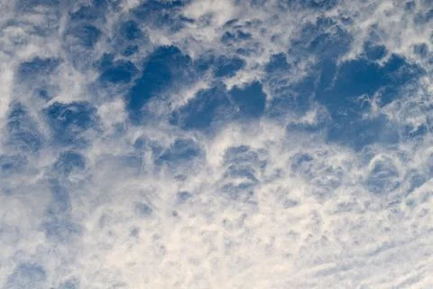 Dramatic and Mesmerizing Cloud Patterns Formed in a Stunningly Beautiful Blue Sk Stock Photos