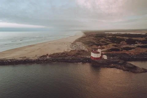 Dramatic and moody sky over Bandon Lighthouse, Oregon Photos