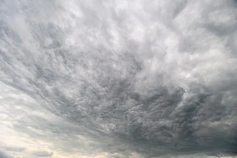 A Dramatic and Overcast Cloudy Sky Filled with Dark Gray Layers and MoodImb.. Stock Photos