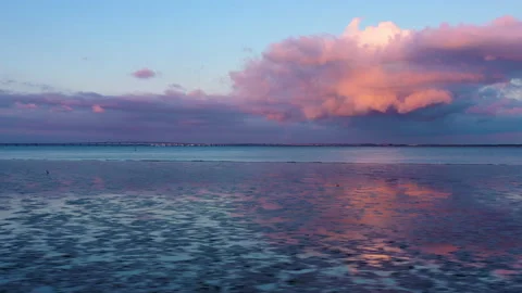 Dramatic and romantic sunset refletions in the water Stock Footage 148428651