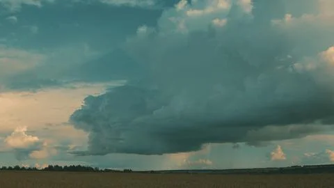 Dramatic and Stunning Cloud Formations Gracefully Gliding Over Open and Expansiv Stock Photos