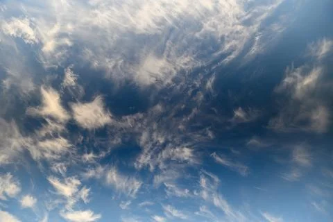 Dramatic and Stunning Cloud Patterns Elegantly Set Against a Clear, Bright Blue Stock Photos