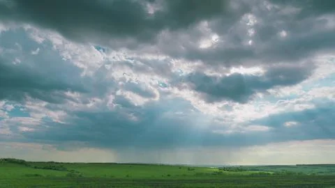 A Dramatic and Stunning Cloudscape Enveloping a Beautiful, Lush Green Landscape Stock Photos