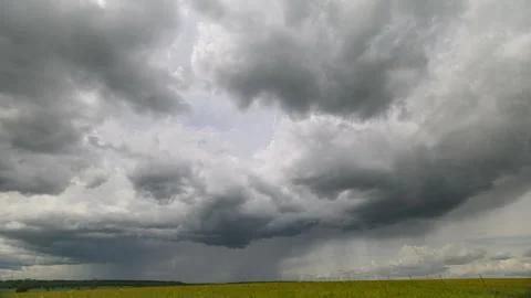 Dramatic and Vast Cloudscapes Picture Perfectly Over Green and Lush Scenic Field Stock Footage 313347352
