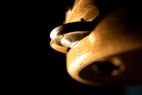 Dramatic Angled Closeup of Side of Tambourine and Zills on Black Background Foto stock