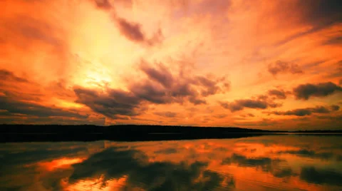 Dramatic Apocalyptic sunset and clouds over forest  lake, time-lapse Stock Footage 29659326