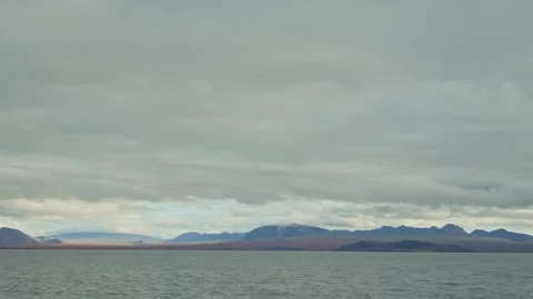 Dramatic Arctic Seascape with Mountains and Cloudy Sky Stock Footage 320515725