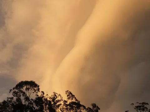 A dramatic array of storm clouds at sunset Foto stock