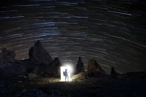 Dramatic Astronaut Figure Among the Night Stars Stock Photos