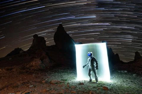 Dramatic Astronaut Figure Among the Night Stars Stock Photos