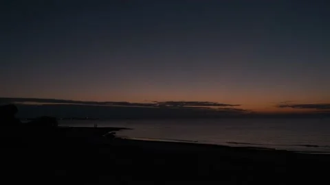 Dramatic atmosphere of a sunset on the beach Stock Footage 167800314