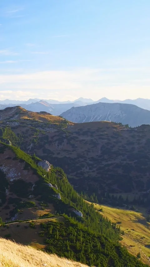 Dramatic Autumn Sky Over the Sfenspitze Peaks With Deep Valleys, Forested Slo Stock Footage 308879224