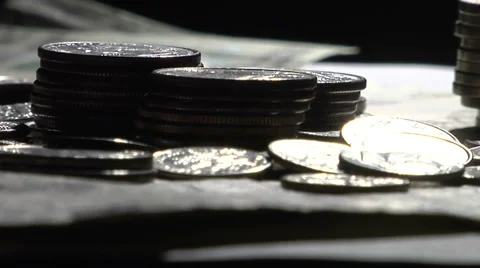 Dramatic Back Lit Coins and Money Stock Footage 35780086