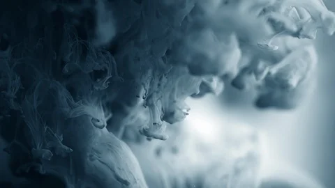 Dramatic background. Colored dark gradient grey ink dropped into water. Lovely Stock Footage 99788216