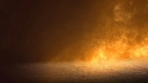 Dramatic background featuring golden smoke, glowing fire particles, and a t.. Stock Photos