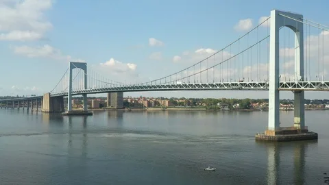 Dramatic backwards descending aerial of bridge revealing trees in foreground 스톡 동영상 114250837