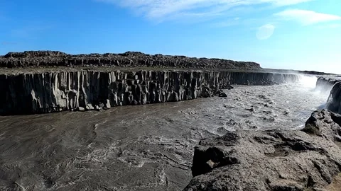 Dramatic basalt columns and turbulent river at Dettifoss canyon Stock Footage 333516208