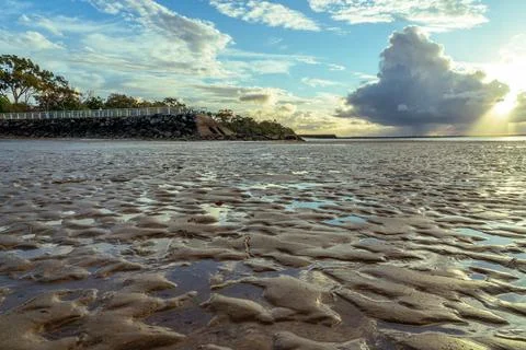 Dramatic beach and sky scene Stock Photos