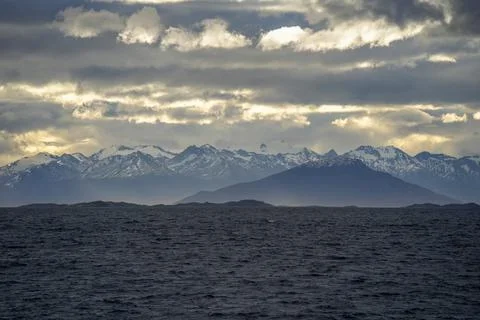 Dramatic Beagle Channel with Snow-Capped Andes and Stormy Sky Stock Photos