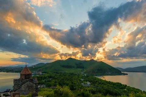 Dramatic beautiful sky at sunset over Sevan, view of Sevanavank Monastery, Ar 스톡 사진