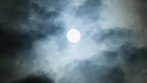 Dramatic big moon on night blue sky on cloudy day. Clouds run slowly. Magic time Stock Footage 108023765