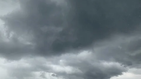 Dramatic big storming dark rain clouds on sky timelapse Stock Footage 116795975