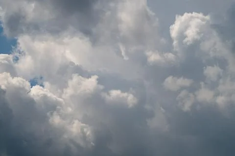 Dramatic billowing cumulus clouds against a soft blue sky Stock Photos
