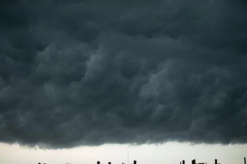 Dramatic black and blue storm clouds. Storm cloud. Black sky, storm weather. Stock Photos