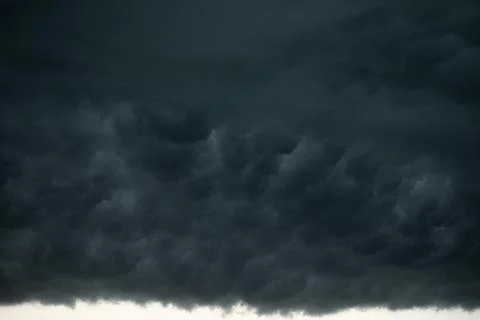 Dramatic black and blue storm clouds. Storm cloud. Black sky, storm weather. 写真素材