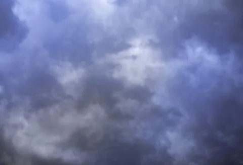 Dramatic black and blue storm clouds. Storm cloud. Black sky, storm weather. Stock Photos