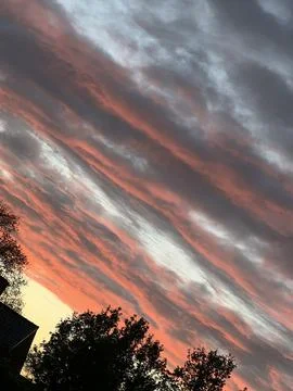 Dramatic Black and Orange Clouds at Sunset 스톡 사진