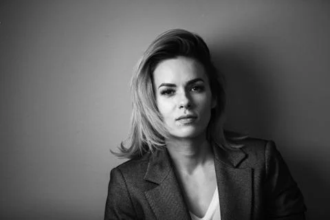 Dramatic black and white portrait of a beautiful woman on a dark background Stock Photos