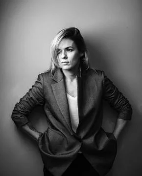 Dramatic black and white portrait of a beautiful woman on a dark background Stock Photos