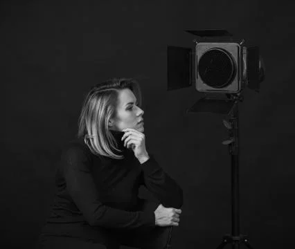 Dramatic black and white portrait of a beautiful woman on a dark background Stock Photos
