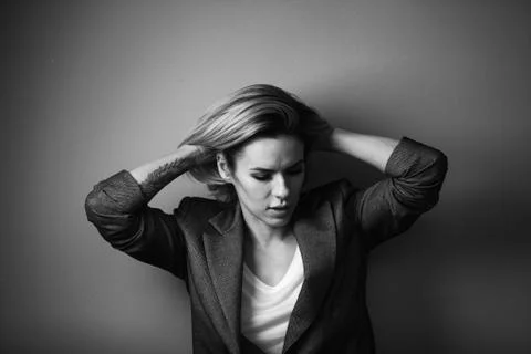 Dramatic black and white portrait of a beautiful woman on a dark background Stock Photos