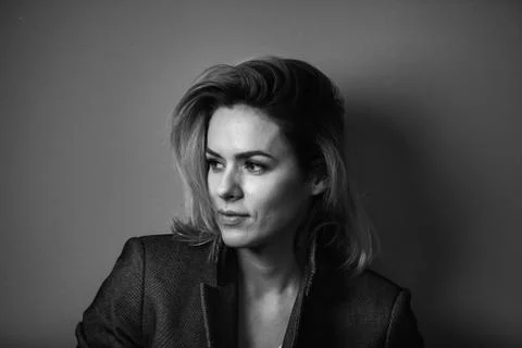 Dramatic black and white portrait of a beautiful woman on a dark background Stock Photos