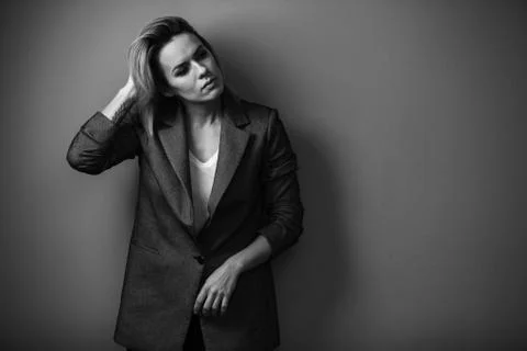Dramatic black and white portrait of a beautiful woman on a dark background Stock Photos