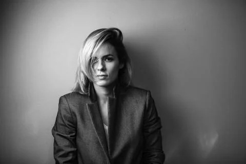 Dramatic black and white portrait of a beautiful woman on a dark background Stock Photos