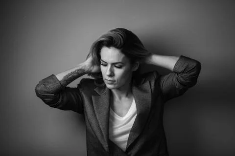 Dramatic black and white portrait of a beautiful woman on a dark background Stock Photos
