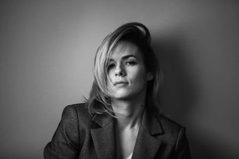 Dramatic black and white portrait of a beautiful woman on a dark background Stock Photos