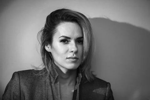 Dramatic black and white portrait of a beautiful woman on a dark background Stock Photos