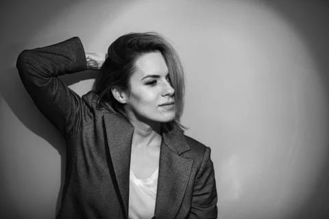 Dramatic black and white portrait of a beautiful woman on a dark background Stock Photos